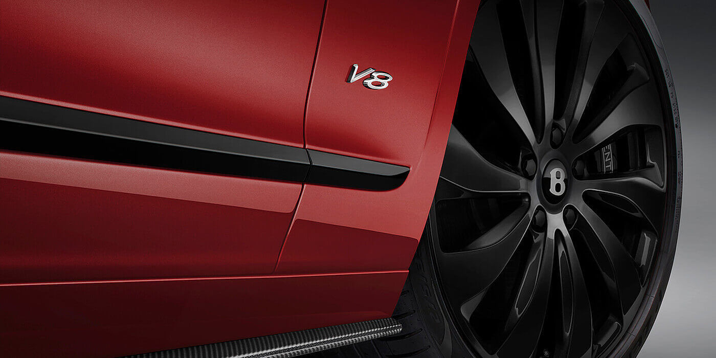 new-Bentley-Flying-Spur-V8-in-Dragon-Red-2-paint-colour-with-black-wheel-and-V8-badge